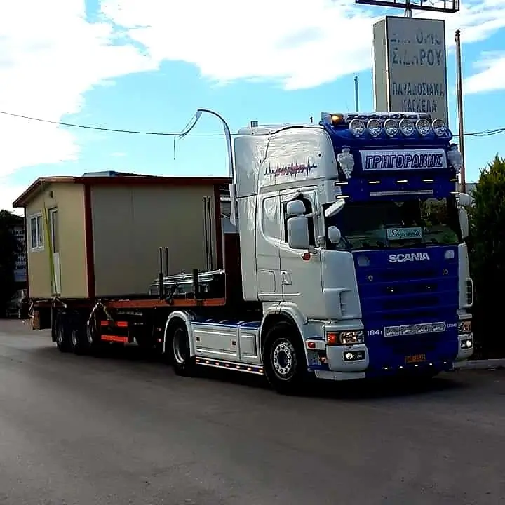 Truck transporting a house